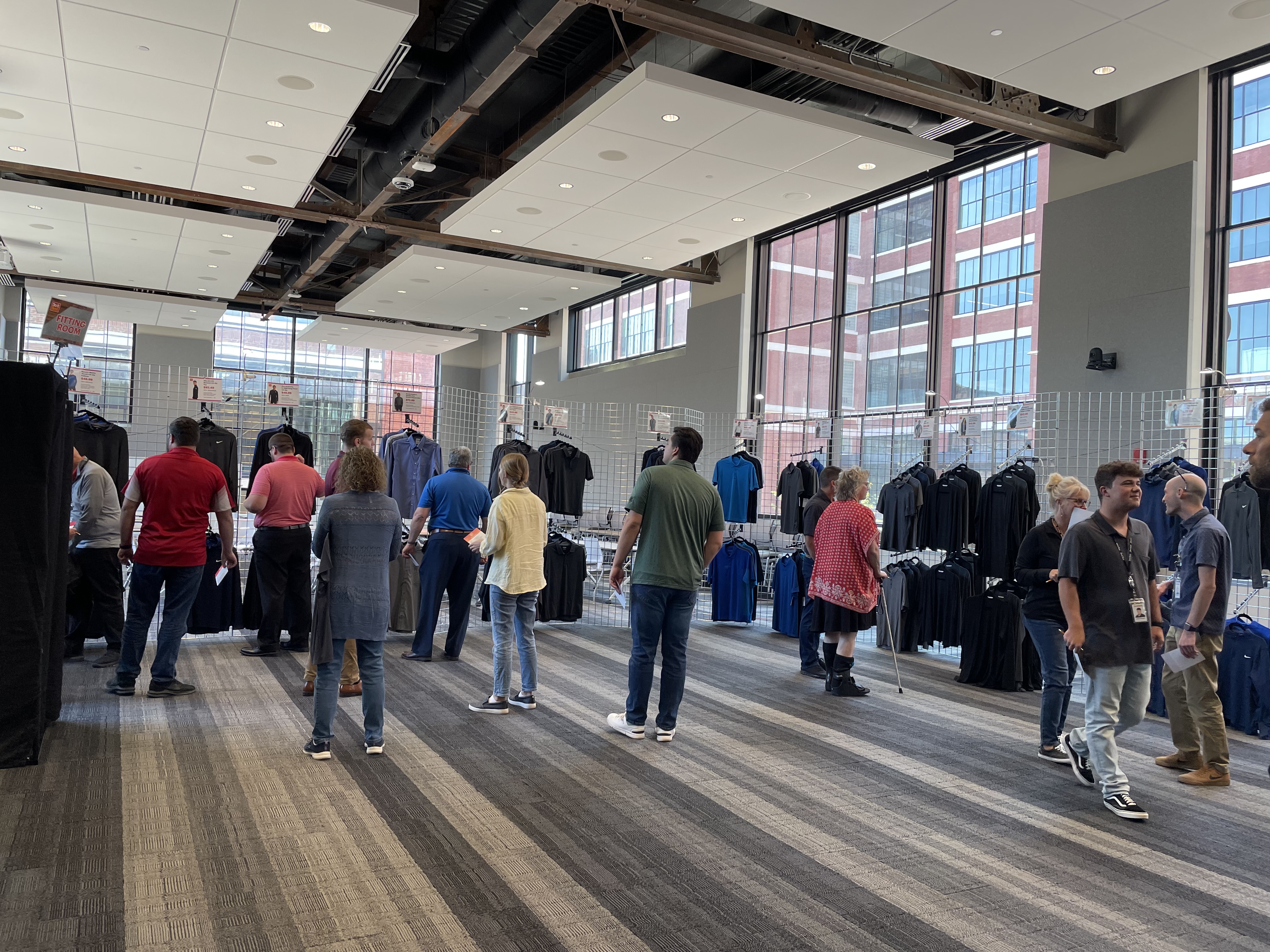 People browsing clothing options